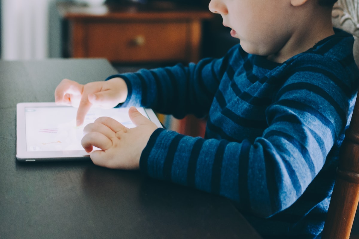 Child learning independently on a tablet